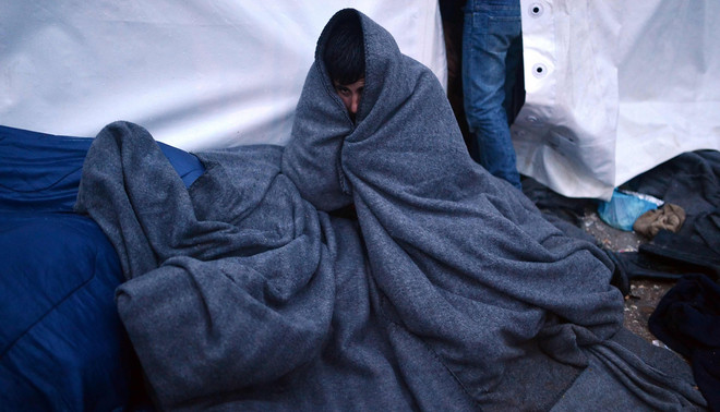 Vluchtelingen zijn gestrand op de grens van Griekenland en Macedonië, begin maart 2016. Foto: Louisa Gouliamaki / AFP